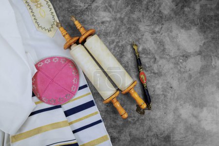 Orthodox Jewish holiday symbols: prayer shawl tallit, prayer holy torah scroll, kippah