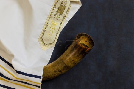 Photo for Holiday symbols for Jewish Orthodox Jews include prayer shawls, horn, shofar - Royalty Free Image