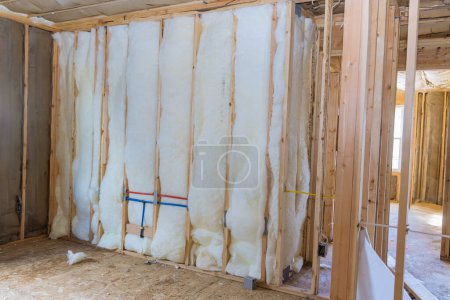 Work on insulation wall of new residential building