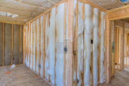 New residential home is being constructed with an insulation wall