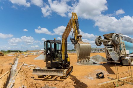 Large excavator working is dig on earthwork an industrial site under infrastructure development