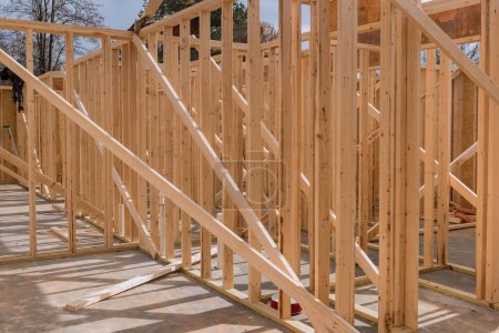 During building construction, new home frame stick beams wood framing