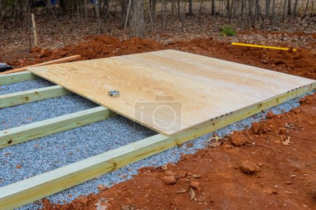 Preparation wooden platform for installation of storage shed