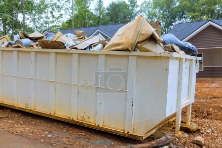 There is metal container dumpster for construction waste