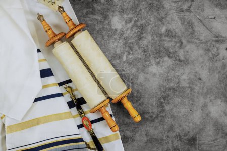 Photo for There are symbols associated with Jewish Orthodox holidays: prayer shawl tallit, torah scroll - Royalty Free Image