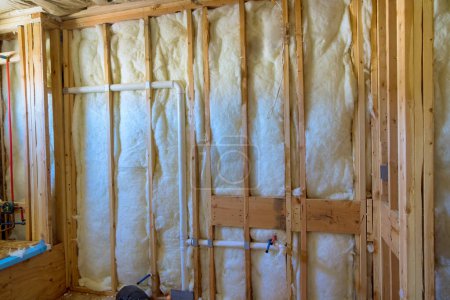 An insulation wall is being constructed for new residential building