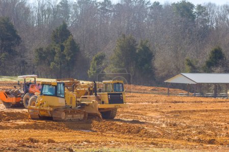 Construction site is being prepared for infrastructure property with help of heavy equipment