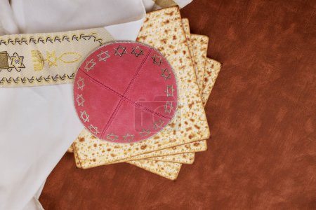 Passover unleavened bread Matzah is part of traditional Jewish ritual, kippah tallit are symbols of this celebration