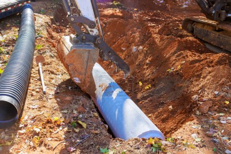 Photo for Laying pipes at construction site in order to collect rainwater - Royalty Free Image