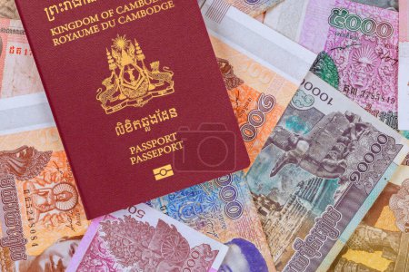 Cambodian passports over Cambodian banknotes in different Riels
