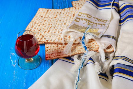 Red kosher wine unleavened bread matzo during seder meal with Pesach celebration holiday
