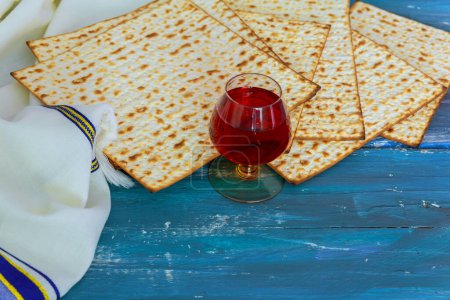 Photo for Matzo unleavened bread red kosher wine, symbolizes haste of Israelites departure from Egypt. - Royalty Free Image