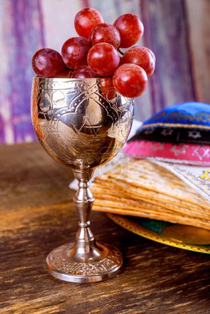 Photo for Jewish matzah unleavened bread, wine cup with Passover holiday attributes - Royalty Free Image