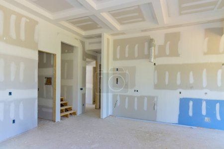 New home construction with gypsum plaster walls drywall ready for painting