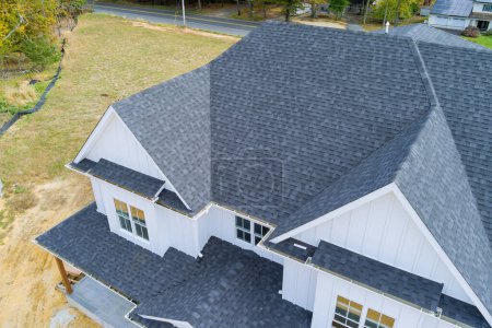 Asphalt shingles cover roof of newly constructed house
