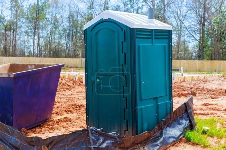 Photo for Portable outdoor transportable toilet restrooms for workers at construction site - Royalty Free Image