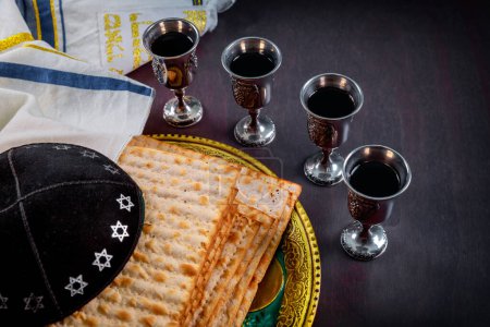 Photo for Jews worldwide unite in observance of this sacred holiday with red kosher wine unleavened bread matzo - Royalty Free Image