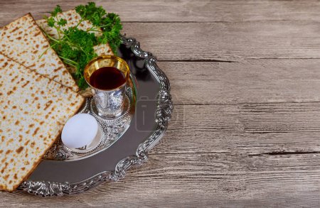 Passover holiday with kosher wine cup, matzah flatbread, Jewish Pesach attributes