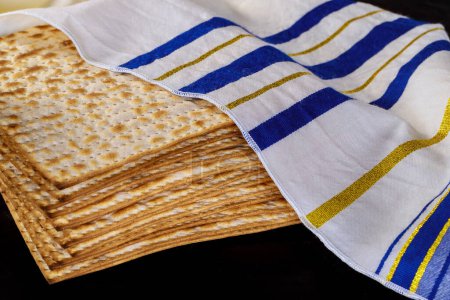 Photo for Passover celebration setting table with matzah bread for Jewish holiday - Royalty Free Image