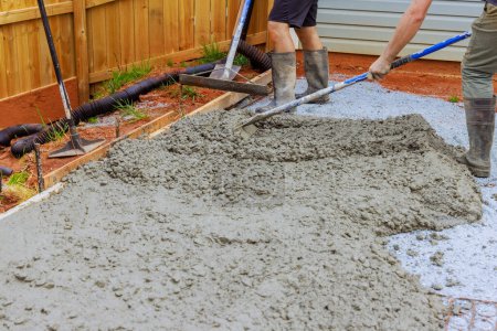 Photo for Leveling concrete by using special tool by construction worker - Royalty Free Image