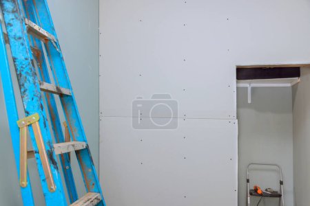 Photo for During renovation, drywall screws were used to mount plasterboard to wooden beams. - Royalty Free Image