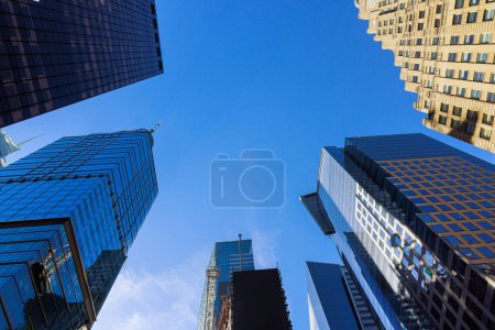 Skyscrapers business office buildings bottom up of modern city urban landscape Manhattan New York City USA