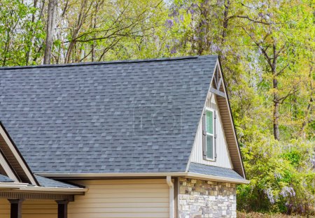 Photo for On newly constructed home, overlapping asphalt shingles are seen on roof - Royalty Free Image