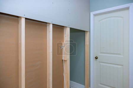 Photo for At renovation project, plasterboard is mounted to wooden beams with drywall screws - Royalty Free Image