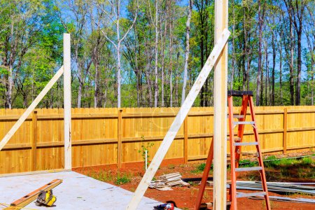 Photo for Work in progress view of construction unfinished house with wooden framing beams - Royalty Free Image