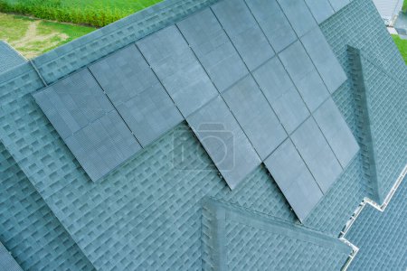 Solar photovoltaic panels on roof of house with green energy renewable energy