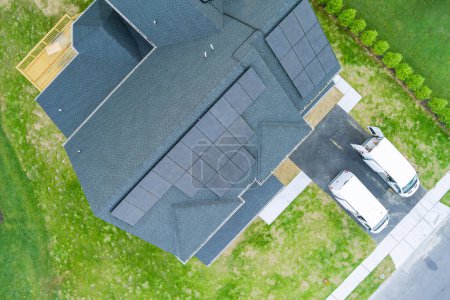 Solar photovoltaic panels on roof of house with green power renewable energy