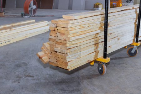 Timber wooden boards are stacked on construction site are ready for use