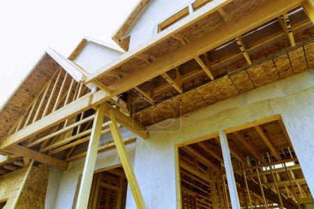 Photo for There is joist framework with plywood installed, gutter holders trim installed on soffit fascia house that is under construction - Royalty Free Image