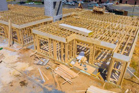 In building construction, are wooden beams forming roof of new home during construction of roof wall