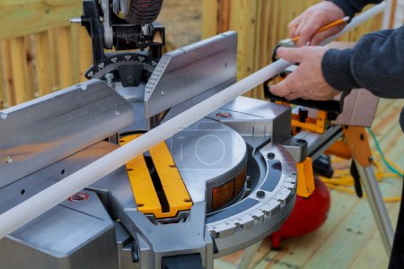 Before circular saw is used for installation of wooden moldings, contractor cuts them using circular saw