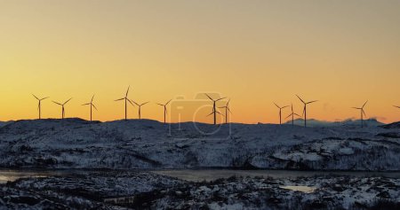 Twilight Vigil on the Arctic Front: Lofotens Wind Turbines. High quality 4k footage