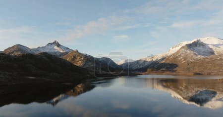 Mirror of Nature: Lofoten Mountains Reflected in Calm Waters. High quality 4k footage