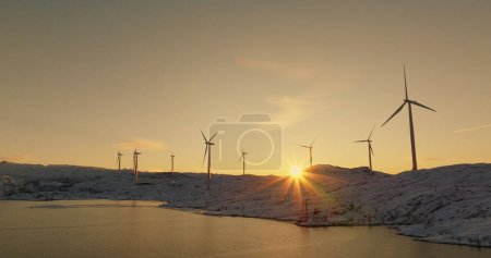 Renewable Energy at Twilight: Wind Turbines in the Snowy Landscape of Norway. High quality 4k footage