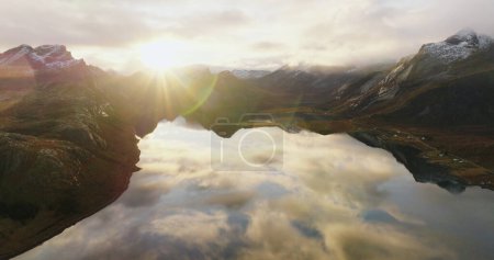 Sunset Reflections Over Serene Mountain Lake - Aerial View. High quality 4k footage