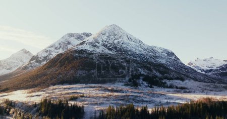 Winters Majesty: Snow-Capped Peaks at Dawn in Norway. High quality 4k footage