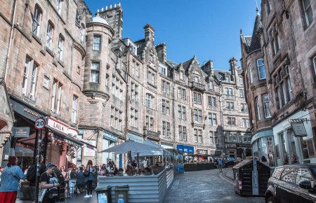 Photo for Edinburg, UK - August 23, 2022: Cockburn street with lots cafes and restaurants and walking people - Royalty Free Image
