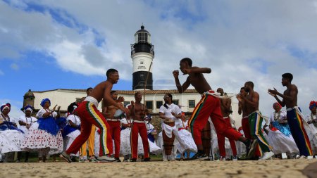 Photo for Salvador, bahia, brazil - july 4, 2023: capoeiristas perform at Farol da Barra during the launch of the Chinese automaker BYD factory, which will open a factory in the city of Camacari. - Royalty Free Image