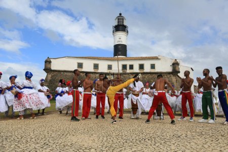 Photo for Salvador, bahia, brazil - july 4, 2023: capoeiristas perform at Farol da Barra during the launch of the Chinese automaker BYD factory, which will open a factory in the city of Camacari. - Royalty Free Image