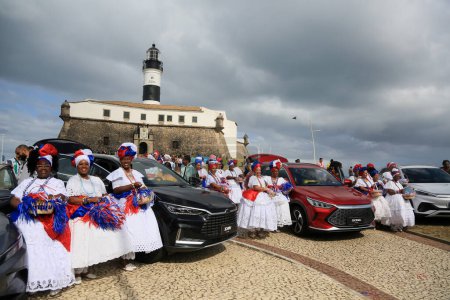 Photo for Salvador, bahia, brazil - july 4, 2023: baianas make the reception at Farol da Barra during the factory launch of the Chinese automaker BYD, which will open a factory in the city of Camacari. - Royalty Free Image