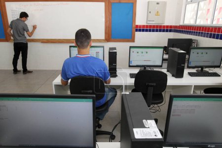 Photo for Aracatu, bahia, brazil - july 7, 2023: A student is seen in a computer lab at a state public school in the city of Aracatu. - Royalty Free Image