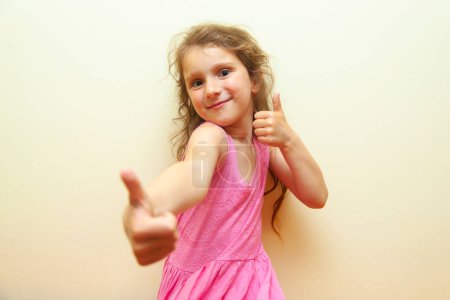 Photo for Crazy little girl with thumbs up - Royalty Free Image
