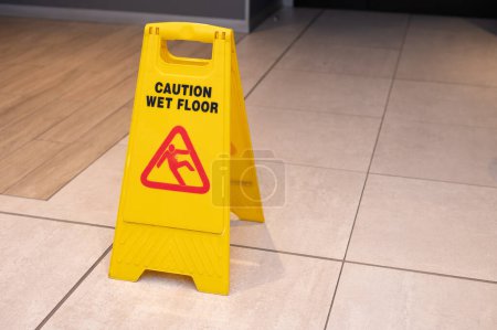 Photo for High angle view of wet floor sign - Royalty Free Image