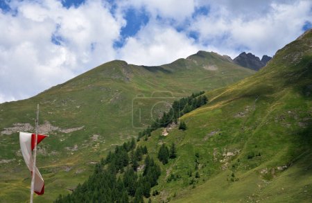 Photo for Mountains on the Italian-Austrian border at Malga Fana in the upper Valles valley with Mount Stilonspitz on the right, a rocky mountain 2759 meters high - Royalty Free Image