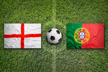 England vs. Portugal flags on green soccer field