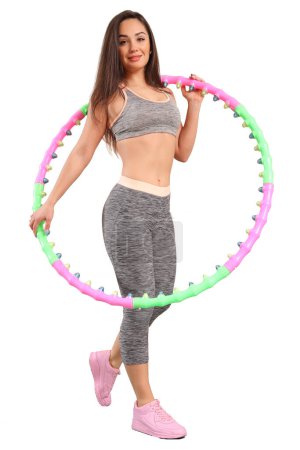 Photo for Woman holding hula hoop - Hula Hoop Exercises - Royalty Free Image